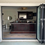 Aluminum bi-folding doors with thermal brake metal. $99 per square foot installed.