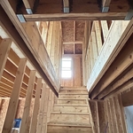 Framing of 2nd story office, bathroom and gym and a set of steps.