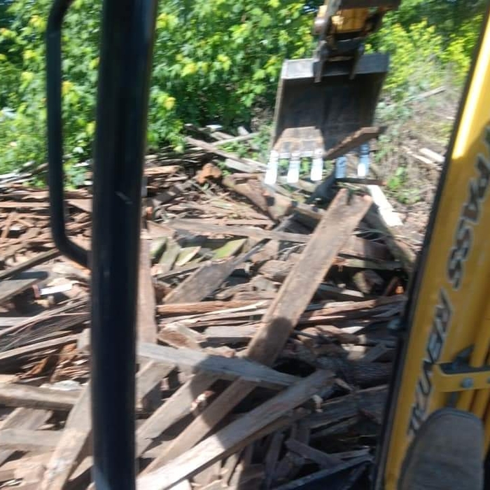 Large lumber pile removed.