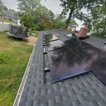 Mid install picture! Notice how the panels are bracketed in and not drilled into the roof individually. This is a common misconception when going solar. This isn't the 2000-2010's anymore! The installation process is much more efficient. If a panel goes bad for whatever reason, since it is bracketed in, it can be easily replaced. This installation also is on a brand new roof that we installed ourselves as well. The panels themselves add extra life to your shingles/roof. The panels act like a sh
