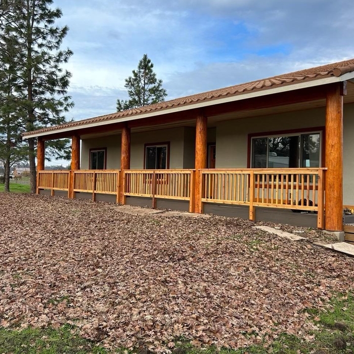 New Deck with railing and log posts