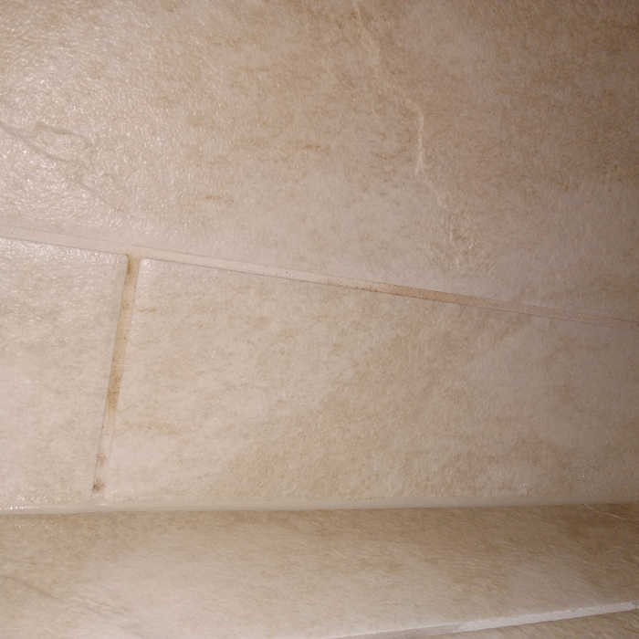 Shower bench before cleaning the mildew