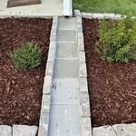 Mulching & stone down spout