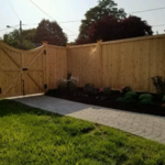 This picture was taken by the customer and sent to me after that had the walkway and landscaping done. The fence looks absolutely beautiful with all the landscaping!