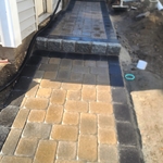 Walkway with retainer wall