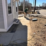 Walkway with retainer wall