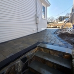 Walkway with retainer wall