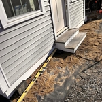 Walkway with retainer wall