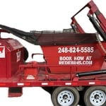 Trailer places the dumpster safely on driveways.