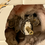 Pulled pin removed cartridge with core puller then replaced cartridge and turned water back on to see no drip