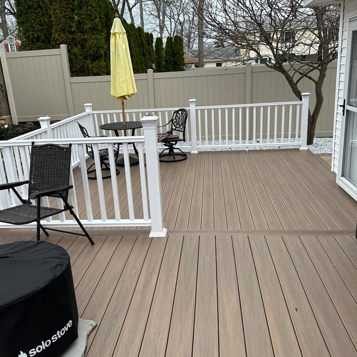 Second level smaller deck connected to side backdoor