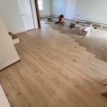 Unfinished project due to a crew coming in to remodel the kitchen. Will be finishing this project within this week. This is a large downstairs area with lvp that seamlessly carries into 3 other rooms including a bathroom.