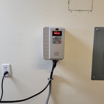 Installed customer supplied components for a 50/60 htz single phase to 3 phase VFD to run an air compressor.