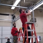 Installing conduit for overhead lighting