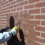 Tuckpointing around property