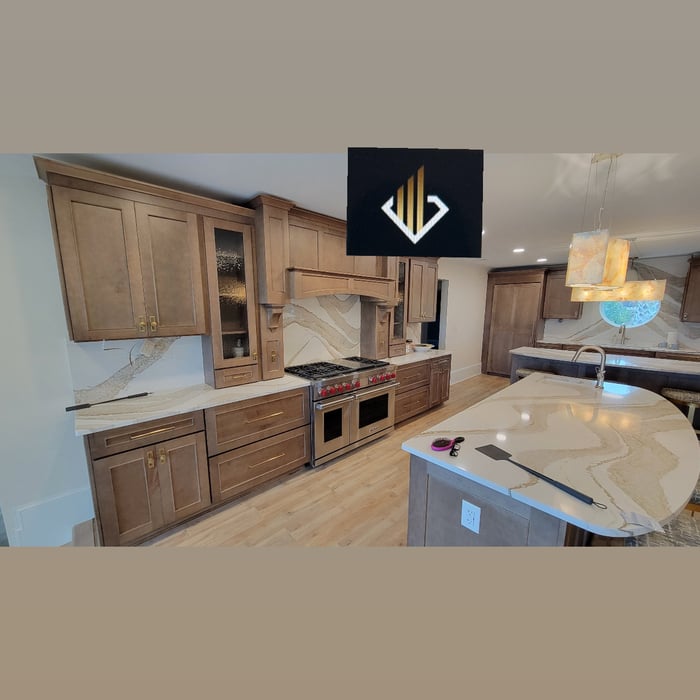 Cambria Britannica Gold Kitchen Countertops With Beautiful Elliptical islands