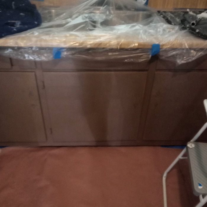 Painted these cabinets white sand and caulk .