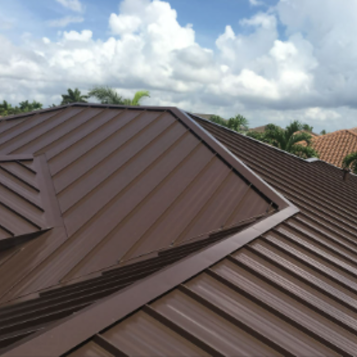 Mansard Brown standing sea metal roof.
