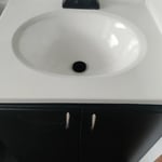 Sink reglazed and cabinet repainted.