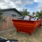 Dumpster at customer backyard for home clean out