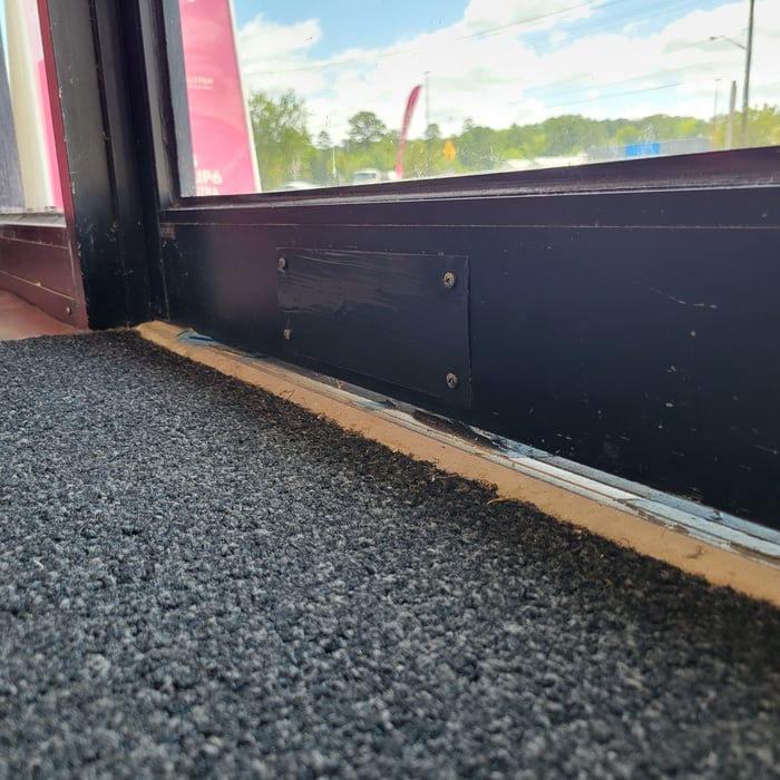The noticeable gap with the old threshold that had been warped from years of traffic.