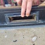 The old mail slot that was unused enough to need replacement, or a new fabrication.