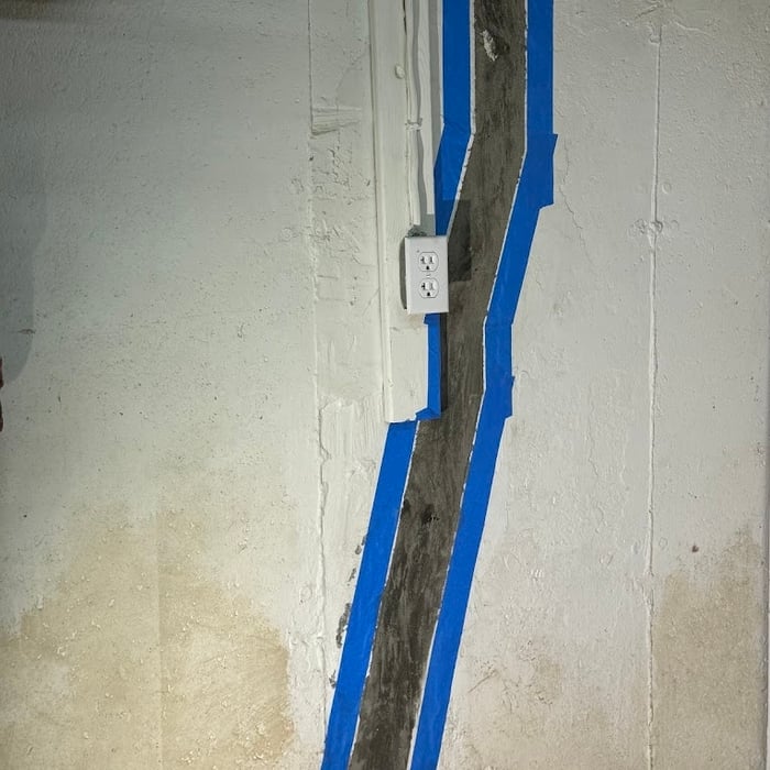 Prepping a crack for repair.