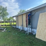 Fix roof leak, remove and replace siding and paint siding and door