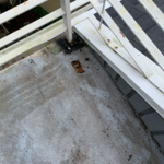 Before picture of deck with hole and leak