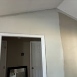 Painted living room. Took a picture halfway done with wall