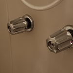 Replace and repair bathroom faucets and reset toilet