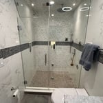 Steam shower, body sprayers, rain head, LED neich, tile floor to cieling.