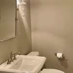 Pool House Half Bathroom, which our One Stop Plumbing, Heating, and Air interior designer selected the fixtures, hardware, pedestal sink and toilet, as well as the wall paint color for project.