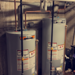Side by side dual water heater installed functioning as a single unit.