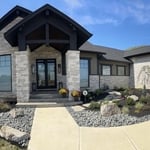 Front entrance of house where landscaping and river rock was utilized