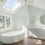 This master bath remodel in Lansdale, PA is opulent from the first glance. The high ceilings, and elegant, classical finishes all lend themselves to the overall luxurious look. Walls were removed to open up the formerly divided bathroom space. The oversized window and skylight allow this gorgeous master bath to be showered in sunlight all day long. The large, contemporary soaking tub is the perfect spot from which to enjoy this beautiful space. The homeowner chose beautiful, subtle colors to co