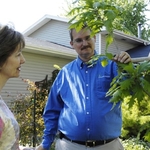 ISA Certified Arborist and West Chicago District Sales Manager, Dave Bruckner, with a client of The Care of Trees.