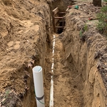 Trench, cleanout, and trench box