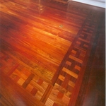 Living room floor of Brazilian Cherry with basket weave border around the edges.