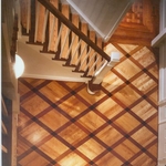 Entry way of Flaming Birch in diamond pattern with individual borders of Brazilian Cherry and Wenge Wood.