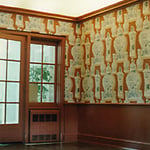 Installation of chairrail and crown moulding with attention to matching all woodwork to the background color of the custom, hand-printed paper in the entrance hall.