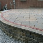 Paver Patio with Border and Castle Block Wall
