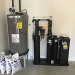 This is an example of what a whole-home water filtration system might look like in your garage.