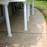 Backyard patio with traditional 2-color stamped concrete