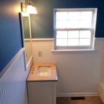 Installed wainscotting and tile floor. Painted ceiling walls and woodwork