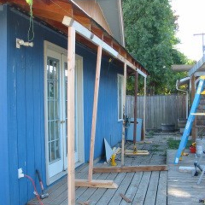 First we lifted the rafters to level with each other, and added under-eave support and facia to keep them there.