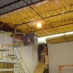 Before Photo of open ceiling in a new shipping area