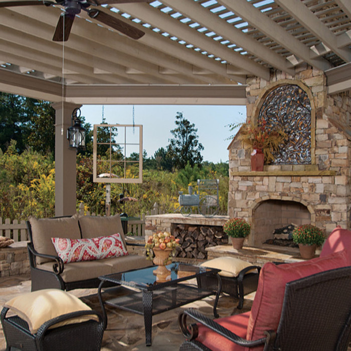 Pergola extends from outdoor kitchen to outdoor living space.