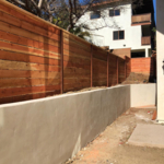 custom fence above retainer wall