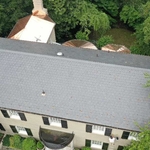 Main part of the home featuring natural slate tiles